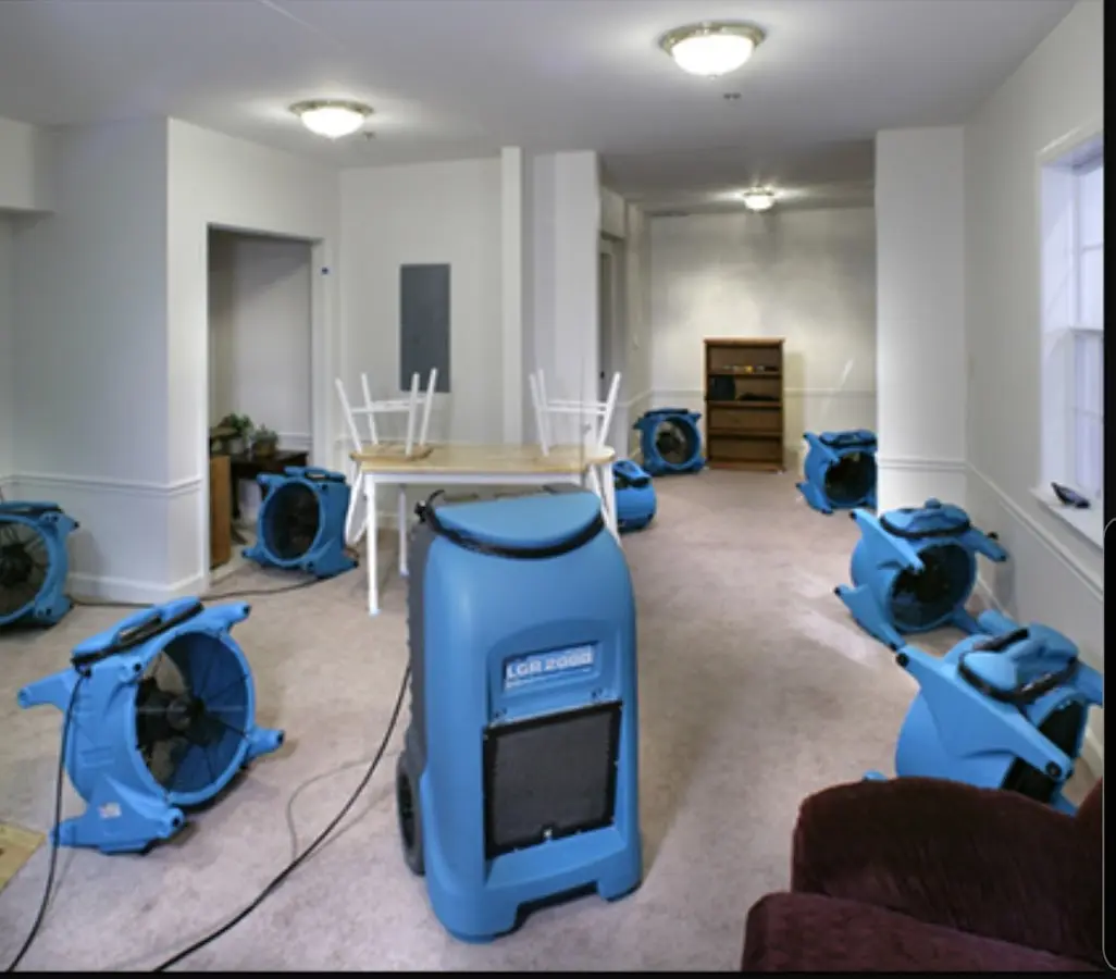 Air movers and dehumidifier setup for Water Damage Restoration in Clinton